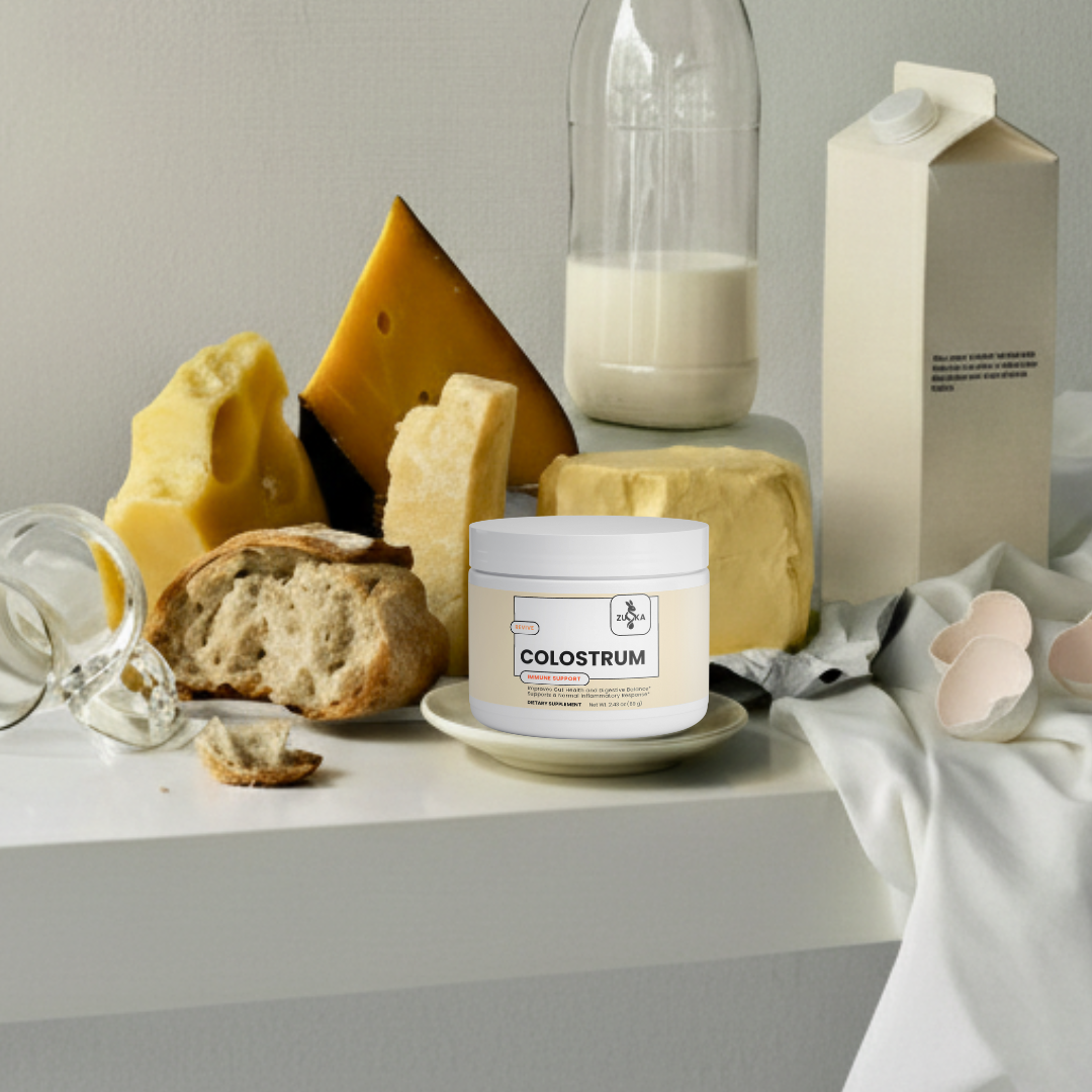 Container of colostrum with cheese, milk, and bread on a table